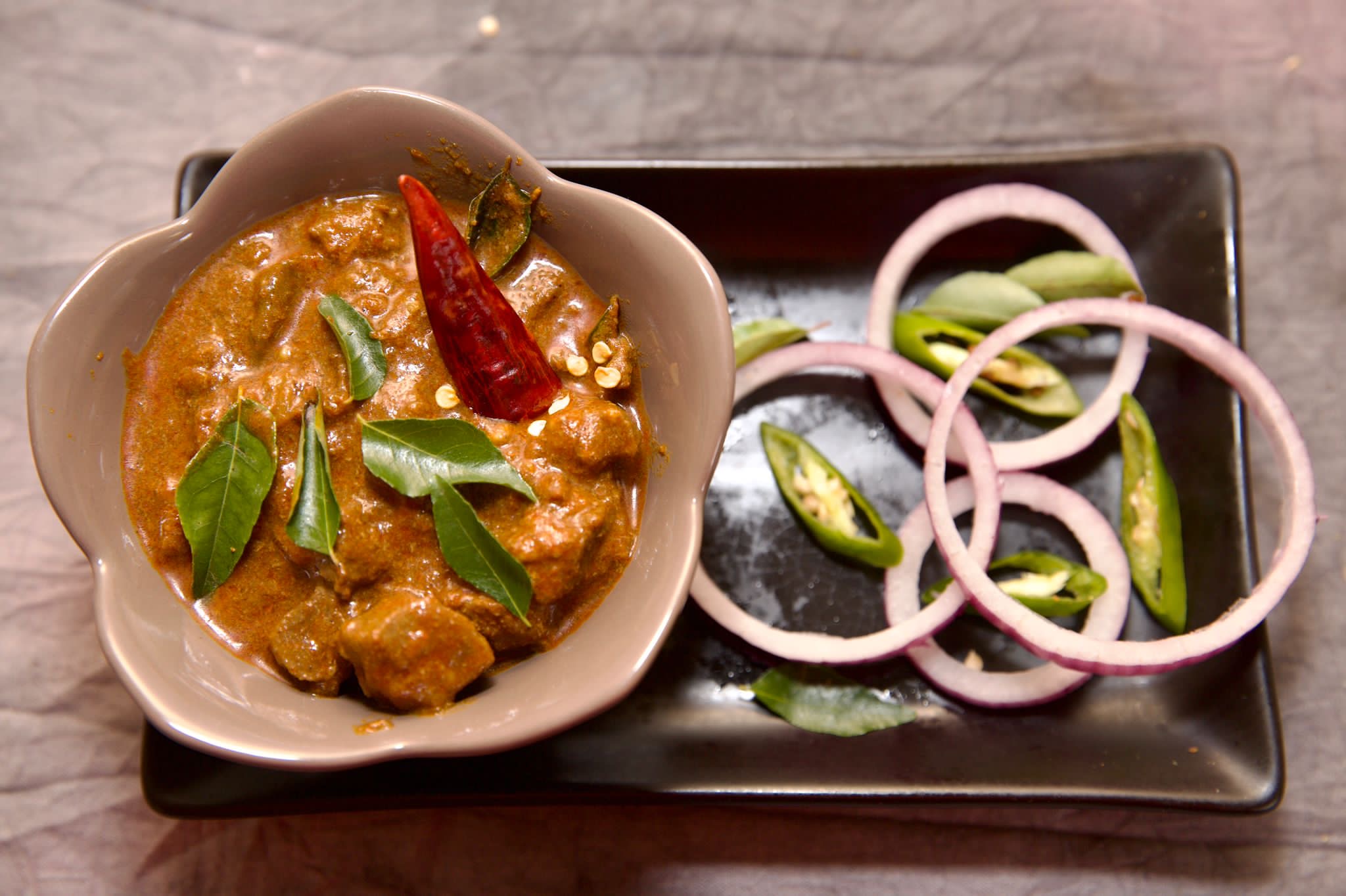 Slow-cooked chicken curry served in a bowl