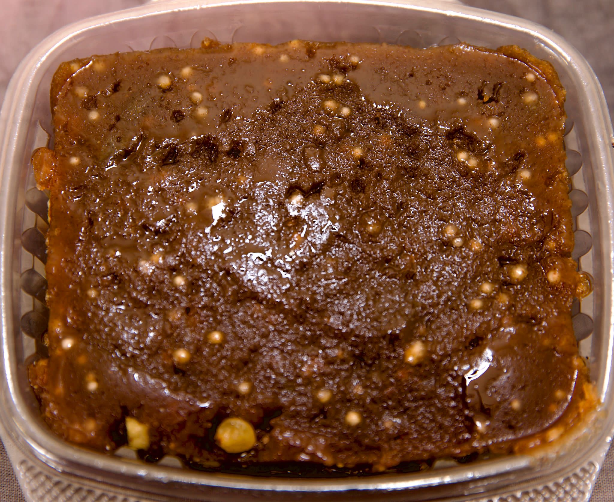 Dark, dense slices of dodol, a coconut and jaggery sweet