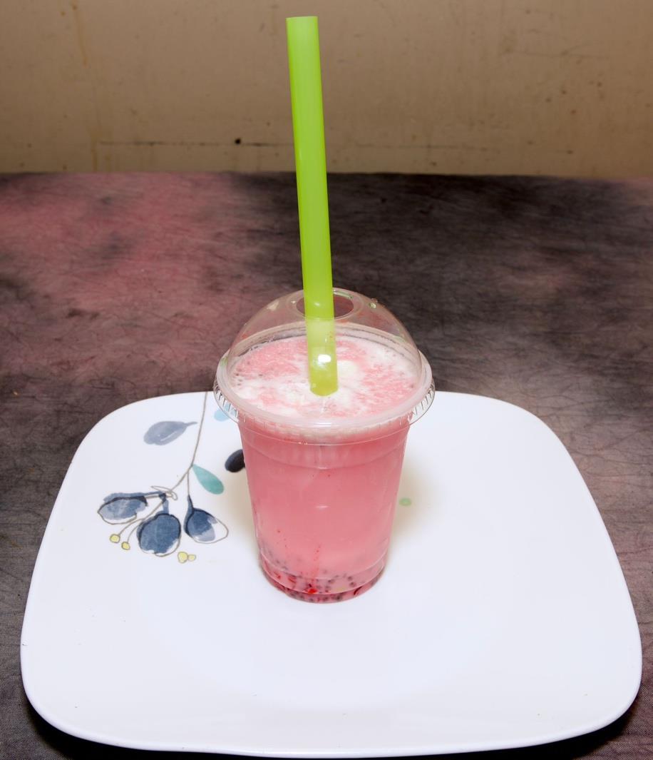 Sherbet vanilla milkshake in a tall glass