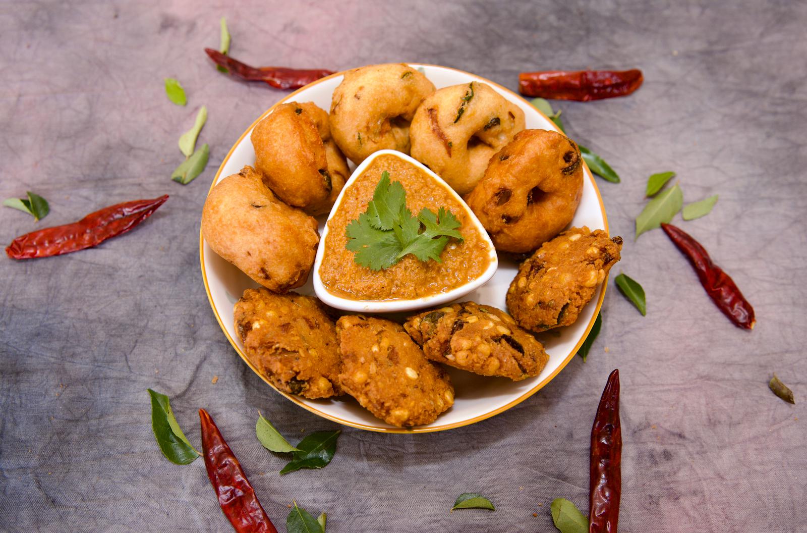 Vada and masala vada served with red coconut chutney